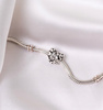 Silver heart-shaped charm adorned with cubic zirconia PETERSO CHP-023